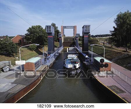 Industrial ship in canal, Ruhr District, North Rhine-Westphalia, Germany View Large Photo Image Stock Photo - Industrial ship in canal, Ruhr District, North Rhine-Westphalia, Germany . Fotosearch