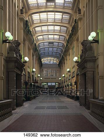 Stock Image - Interiors of lit up shopping mall, Saxony, Germany . Fotosearch