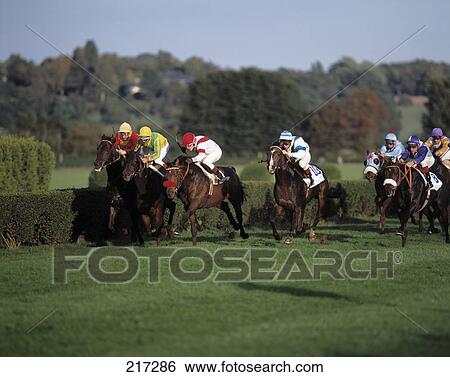 Stock Photograph - Jockeys riding horses during race, Dusseldor, Germany . Fotosearch