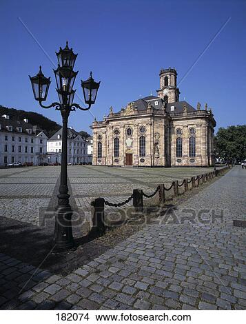 Picture - Lamp post in front of church, Saarland, Germany . Fotosearch