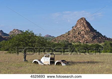 Stock Image - Landscape with old truck at Twyfelfontein, Damaraland, Namibia . Fotosearch