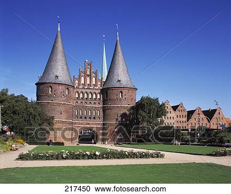 Stock Image - Lawn in front of castle under clear blue sky . Fotosearch