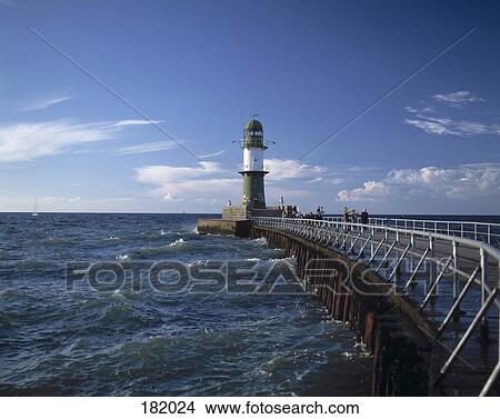 Picture - Lighthouse at coast against blue sky, Mecklenburg-Vorpommern, Germany . Fotosearch