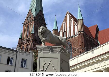 Lion sculpture with cathedral in the background, Schwerin, Germany, low angle view View Large Photo Image Stock Photography - Lion sculpture with cathedral in the background, Schwerin, Germany, low angle view . Fotosearch