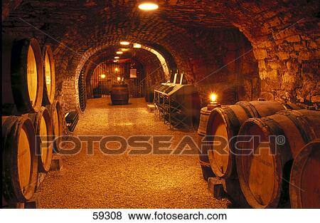 Lit up interiors of wine vine cellar, Beaune, Burgundy, France View Large Photo Image Stock Photo - Lit up interiors of wine vine cellar, Beaune, Burgundy, France . Fotosearch