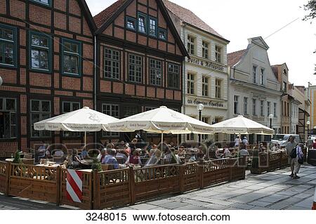 Lively street-side restaurant in the old town, Schwerin, Germany View Large Photo Image Stock Photography - Lively street-side restaurant in the old town, Schwerin, Germany . Fotosearch