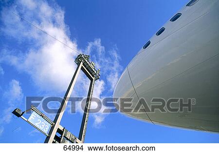 Low angle view of airplane at airport, Frankfurt, Germany View Large Photo Image Picture - Low angle view of airplane at airport, Frankfurt, Germany . Fotosearch
