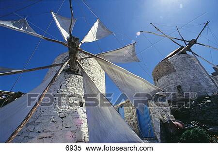 Stock Photography - Low angle view of ancient windmills, Olympos, Karpathos, Greece . Fotosearch