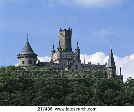 Low angle view of castle against blue sky View Large Photo Image Stock Photograph - Low angle view of castle against blue sky . Fotosearch