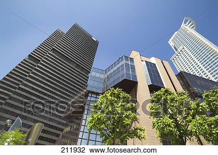 Stock Image - Low angle view of office buildings, Dz Bank, Frankfurt, Hesse, Germany . Fotosearch