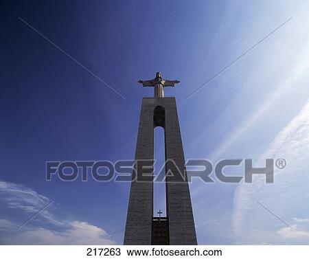 Low angle view of sculpture on column against sky View Large Photo Image Stock Image - Low angle view of sculpture on column against sky . Fotosearch