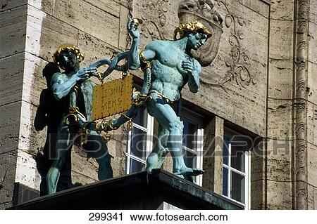 Stock Image - Low angle view of sculptures with signboard, Hannover, Germany . Fotosearch
