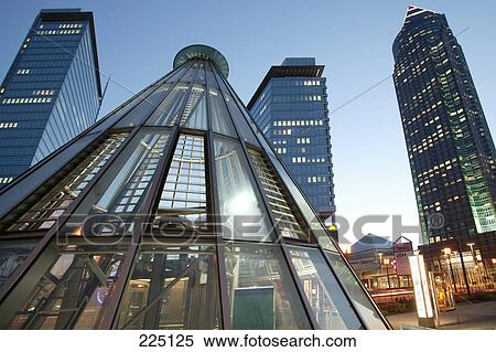 Stock Photography - Low angle view of skyscrapers in city, Messeturm Tower, Frankfurt, Hesse, Germany . Fotosearch