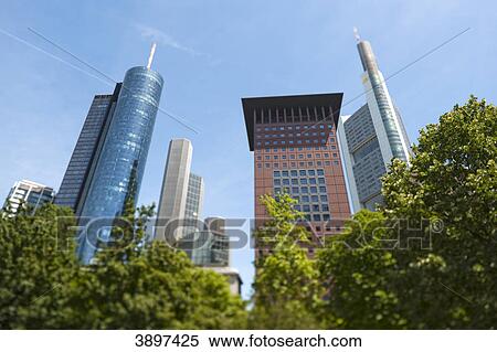 Stock Photography - Main Tower and Japan Center behind trees, Frankfurt am Main, Germany . Fotosearch