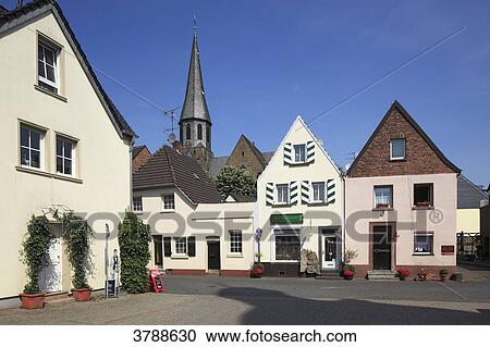 Stock Image - Middle-class houses, Schlosstrasse, Zons, Dormagen, North Rhine-Westphalia, Germany, Europe . Fotosearch
