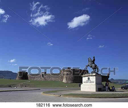 Stock Photograph - Monument in front of fort, Fort of San Felipe, Puerto Plata, Dominican Republic . Fotosearch