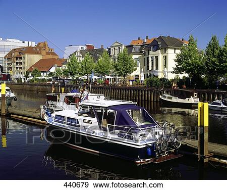 Stock Photo - Motorboats parked at harbor . Fotosearch
