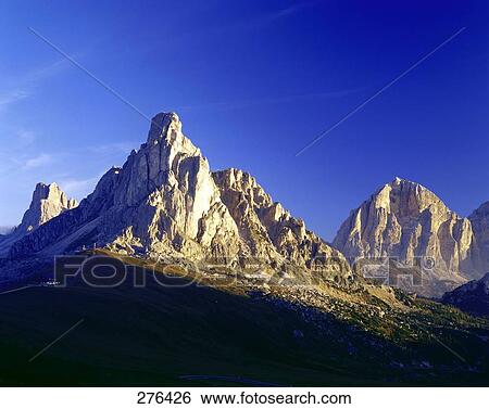 Mountains under blue sky, Mt Tofana, Dolomites, Veneto, Italy View Large Photo Image Stock Photograph - Mountains under blue sky, Mt Tofana, Dolomites, Veneto, Italy . Fotosearch