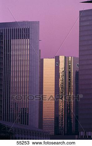 Stock Image - Office buildings in city at sunset, Frankfurt, Germany . Fotosearch
