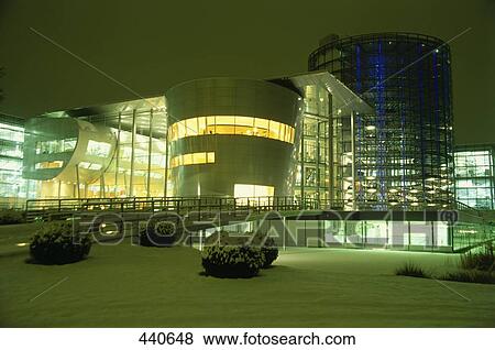 Office buildings lit up at night View Large Photo Image Stock Photo - Office buildings lit up at night . Fotosearch