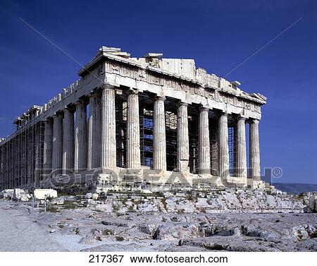 Stock Photo - Old ruins of ancient roman temple against blue sky, Acropolis, Athens, Greece . Fotosearch