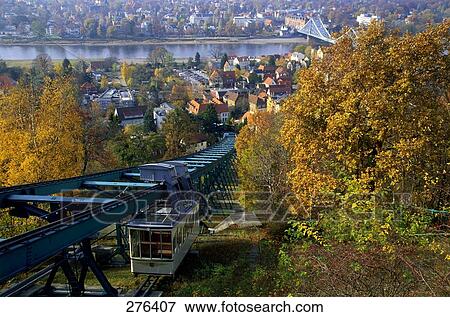 Overhead cable car passing through forest, Elbe River, Dresden, Saxony, Germany View Large Photo Image Stock Photo - Overhead cable car passing through forest, Elbe River, Dresden, Saxony, Germany . Fotosearch