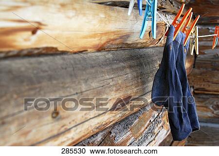 Pair of socks hanging from clothesline View Large Photo Image Stock Image - Pair of socks hanging from clothesline . Fotosearch