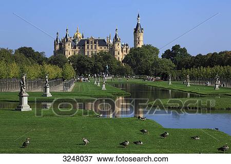 Stock Photo - Palace garden and Schwerin Castle in the background, Schwerin, Germany . Fotosearch