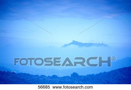 Stock Photography - Panoramic view of a village at dusk . Fotosearch