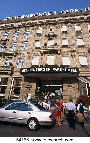 Stock Photograph - People at entrance of hotel, Steigenberger Park Hotel, Duesseldorf, North Rhine-Westphalia, Germany . Fotosearch