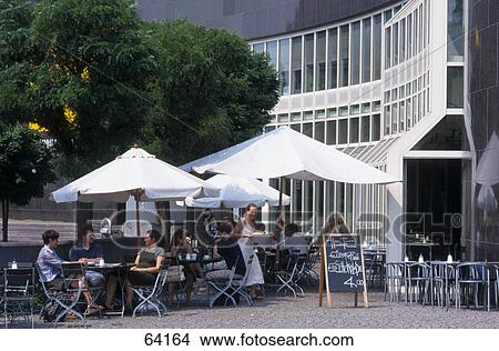 People at sidewalk cafe in front of art museum, Duesseldorf, North Rhine-Westphalia, Germany View Large Photo Image Picture - People at sidewalk cafe in front of art museum, Duesseldorf, North Rhine-Westphalia, Germany . Fotosearch