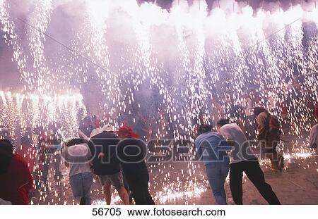 Stock Photography - People burning crackers in church, St. Bartholomaeus Church, Majorca, Balearic Islands, Spain . Fotosearch