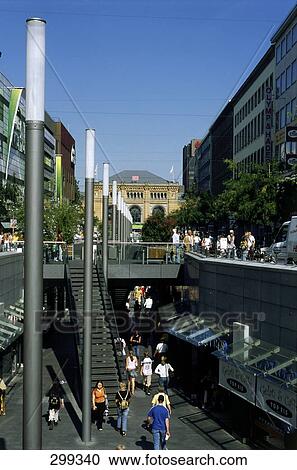 Stock Image - People in street, Bahnhofstrasse, Lower Saxony, Germany . Fotosearch