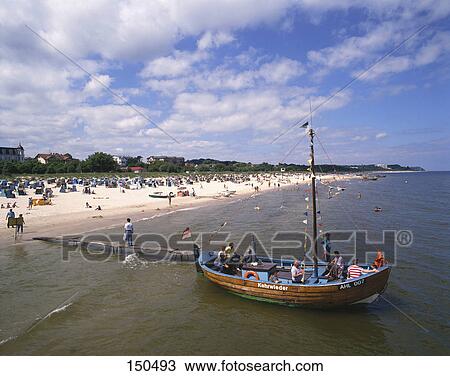 People on boat at beach, Usedom Island, Mecklenburg-Western Pomerania, Germany View Large Photo Image Stock Image - People on boat at beach, Usedom Island, Mecklenburg-Western Pomerania, Germany . Fotosearch
