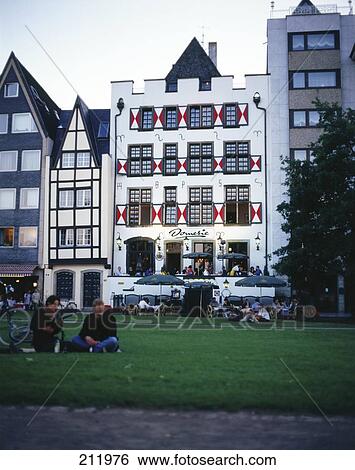 Stock Photograph - People sitting in front of restaurant in garden, Cologne, Germany . Fotosearch