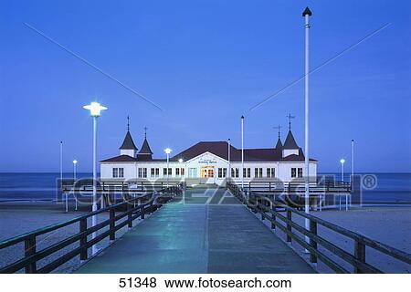Pier leading to house on beach, Ahlbeck Pier, Usedom Island, Germany View Large Photo Image Stock Photo - Pier leading to house on beach, Ahlbeck Pier, Usedom Island, Germany . Fotosearch