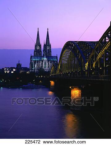 Railroad Bridge across river at dusk, Hohenzollern Bridge, Cologne, Germany View Large Photo Image Stock Image - Railroad Bridge across river at dusk, Hohenzollern Bridge, Cologne, Germany . Fotosearch