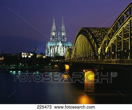 Railroad Bridge across river at dusk, Hohenzollern Bridge, Cologne, Germany View Large Photo Image Stock Image - Railroad Bridge across river at dusk, Hohenzollern Bridge, Cologne, Germany . Fotosearch