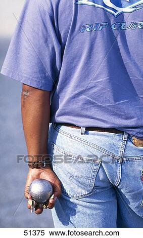 Stock Photography - Rear view of man playing boule, Bordeaux, France . Fotosearch