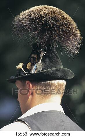 Stock Image - Rear view of man wearing tuft of chamois hair hat, Munich, Bavaria, Germany . Fotosearch