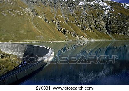 Stock Image - Reflection of mountain in water, Lac de Moiry, Valais Canton, Switzerland . Fotosearch
