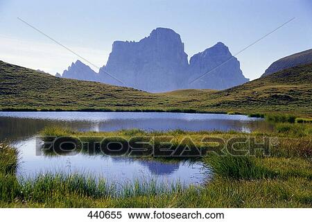 Stock Photography - Reflection of mountain in water, Mt Pelmo, Lago Delle Baste, Veneto, Italy . Fotosearch