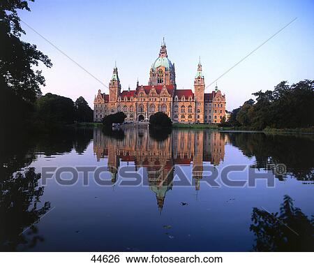 Stock Photograph - Reflection of townhall in water, Lake Maschsee, Hannover, Germany . Fotosearch