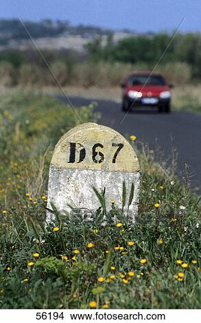 Picture - Road marking stone, Provence, France . Fotosearch