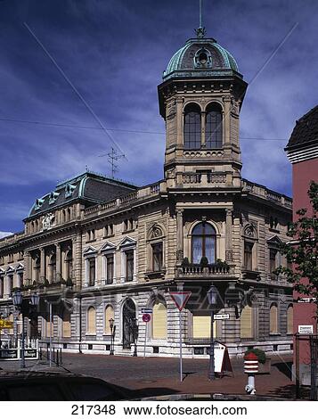 Stock Photo - Road sign in front of building at street . Fotosearch