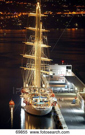 Stock Photography - Sailing ship lit up at harbor, Cote d'Azur, France . Fotosearch