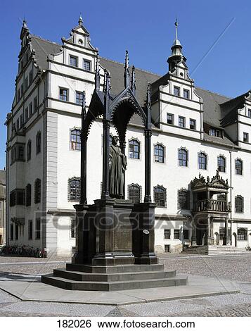 Stock Photograph - Sculpture in front of church, Melanchthon Monument, Luther Memorial Church, Lutherstadt Wittenberg, Germany . Fotosearch