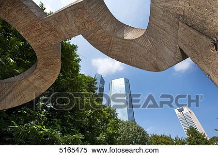 Stock Photography - Sculpture in front of the Deutsche Bank skyscraper, Frankfurt Main, Germany . Fotosearch