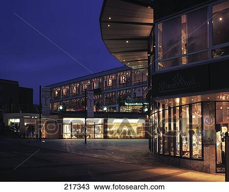 Shopping mall lit up at dusk View Large Photo Image Stock Image - Shopping mall lit up at dusk . Fotosearch