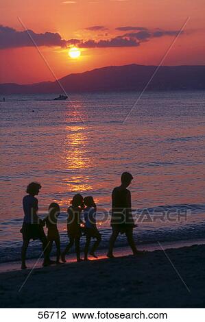 Silhouette of family walking on beach, Majorca, Balearic Islands, Spain View Large Photo Image Stock Image - Silhouette of family walking on beach, Majorca, Balearic Islands, Spain . Fotosearch